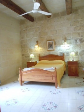GUMMAR holiday house first floor double bedroom with ceiling fan and with en suite shower room