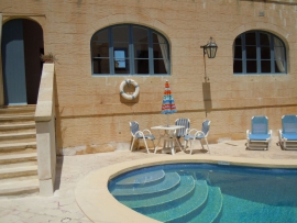 Razzett CIPRESSA swimming pool area with stairs to entrance hallway